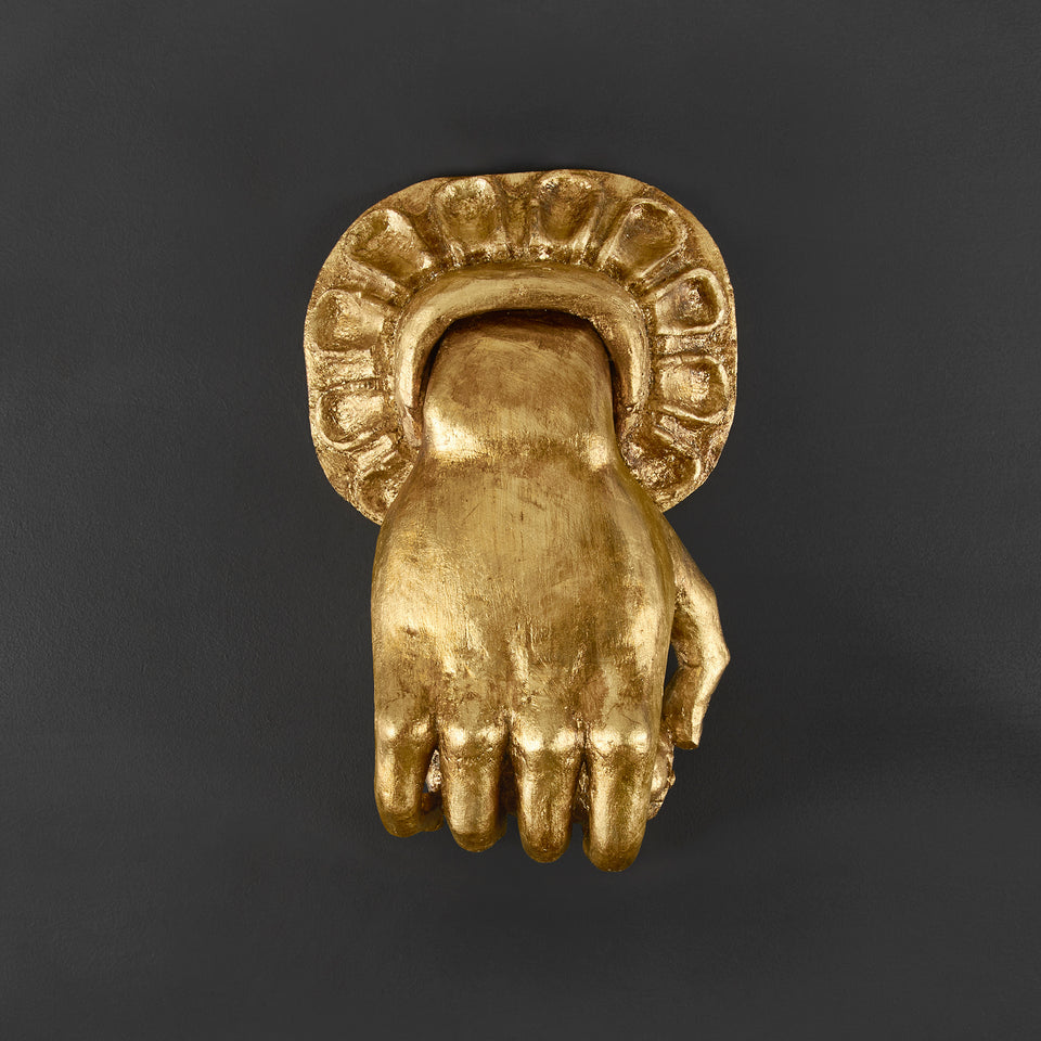 Mano llamador decorativa